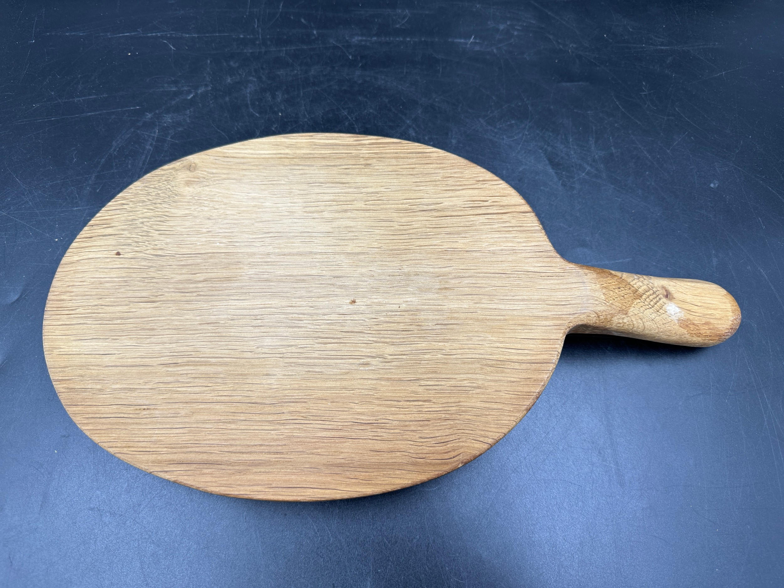 Robert Thompson 'Mouseman' of Kilburn, an adzed oak cheese board of oval form with a carved mouse - Image 4 of 5