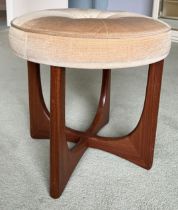 A mid 20thC teak upholstered dressing table stool. 47cm d.