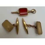 A pair of 9 carat gold cufflinks together with a yellow metal watch key. Weight of cufflinks 5.2gm.