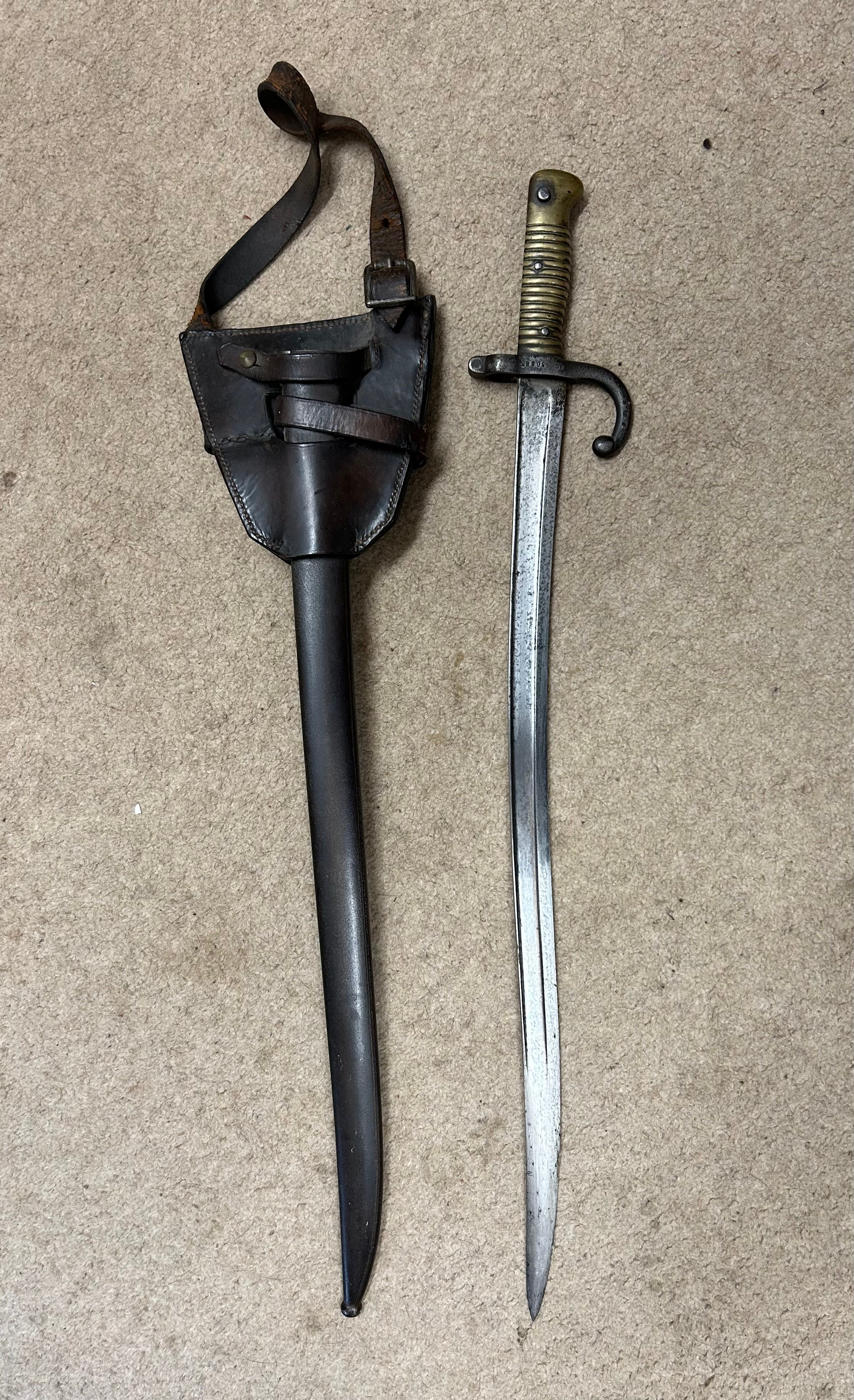 A French Chassepot bayonet sword with single edged blade 57cm in length. Overall 69cm l. Engraved to