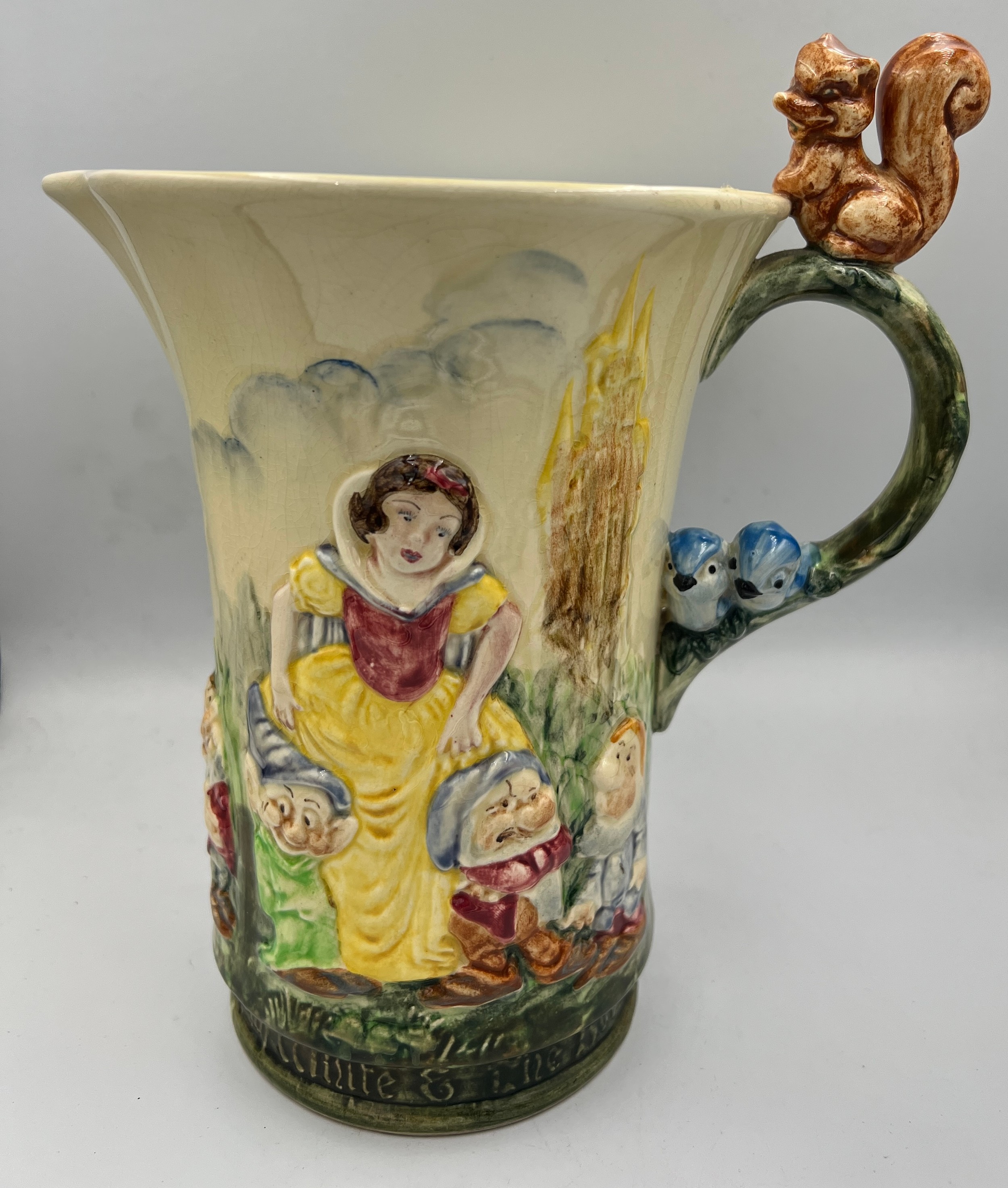 A Wadeheath musical jug, Snow White and the seven dwarfs. 22cm h.