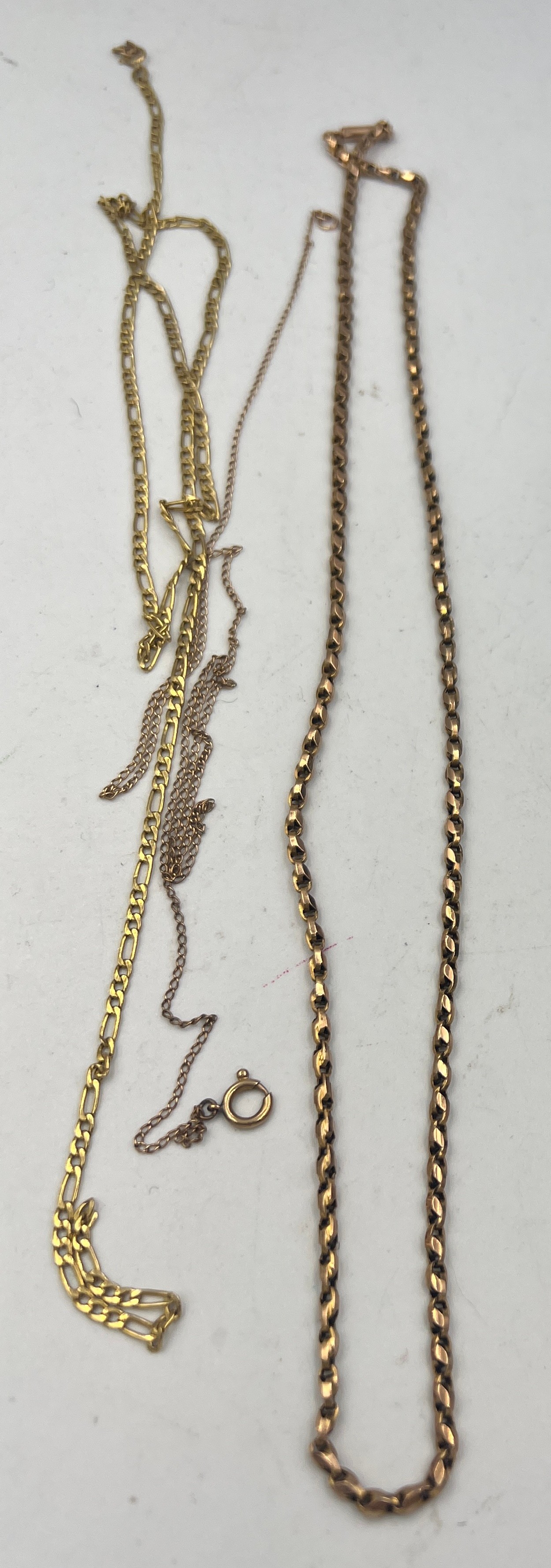 Three 9 carat gold chain necklaces. Total weight 10gm.