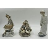 Three Lladro figurines to include 'At the seaside', 'Washing up girl', and 'Friendship.