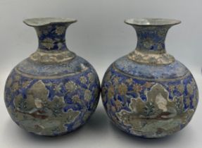 A pair of oriental metal vases with painted decoration. 13cm h.
