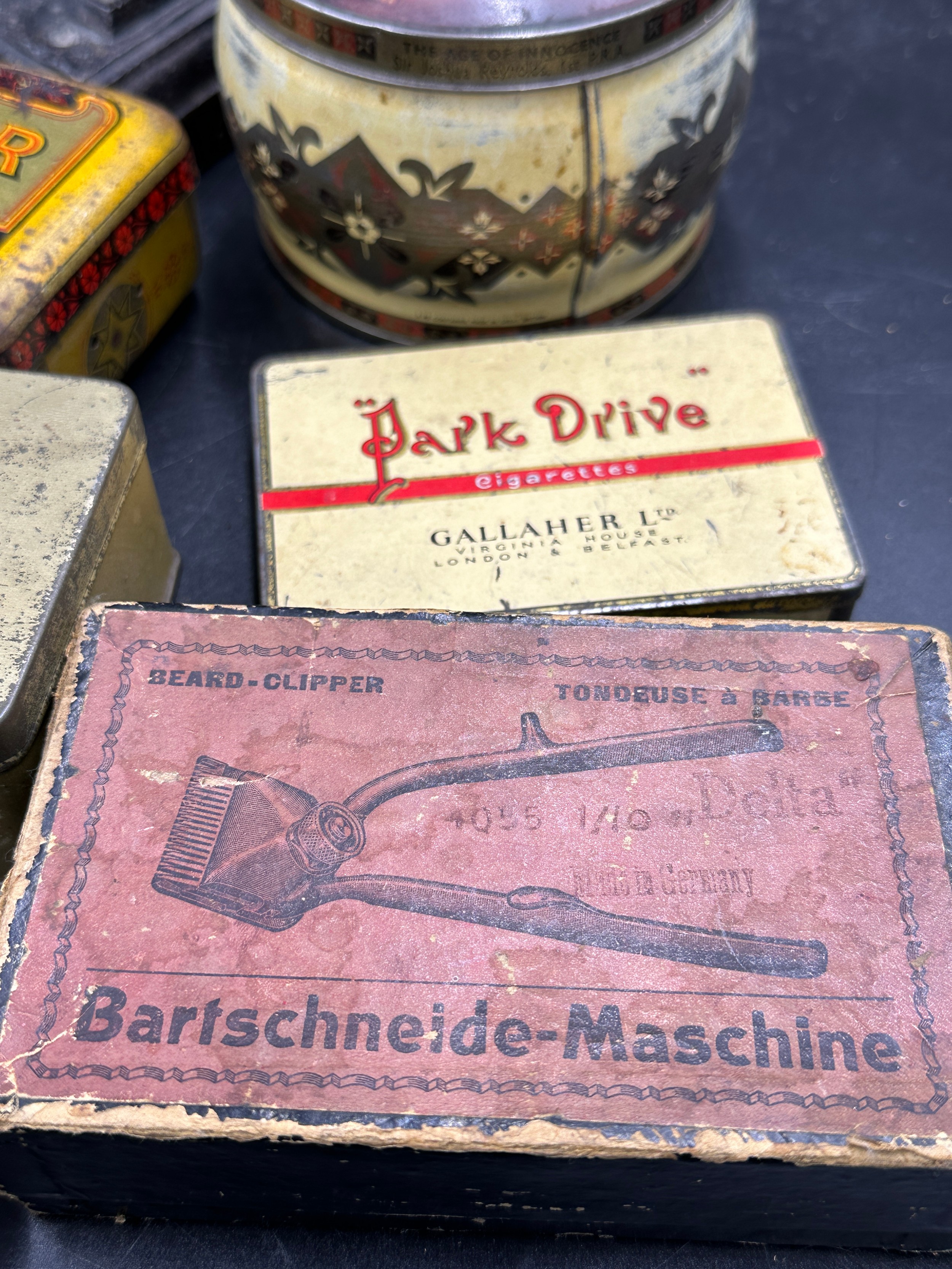 A collection of sad irons, CH Crane, Otto etc together with various tins to include Rowntree's - Image 5 of 10