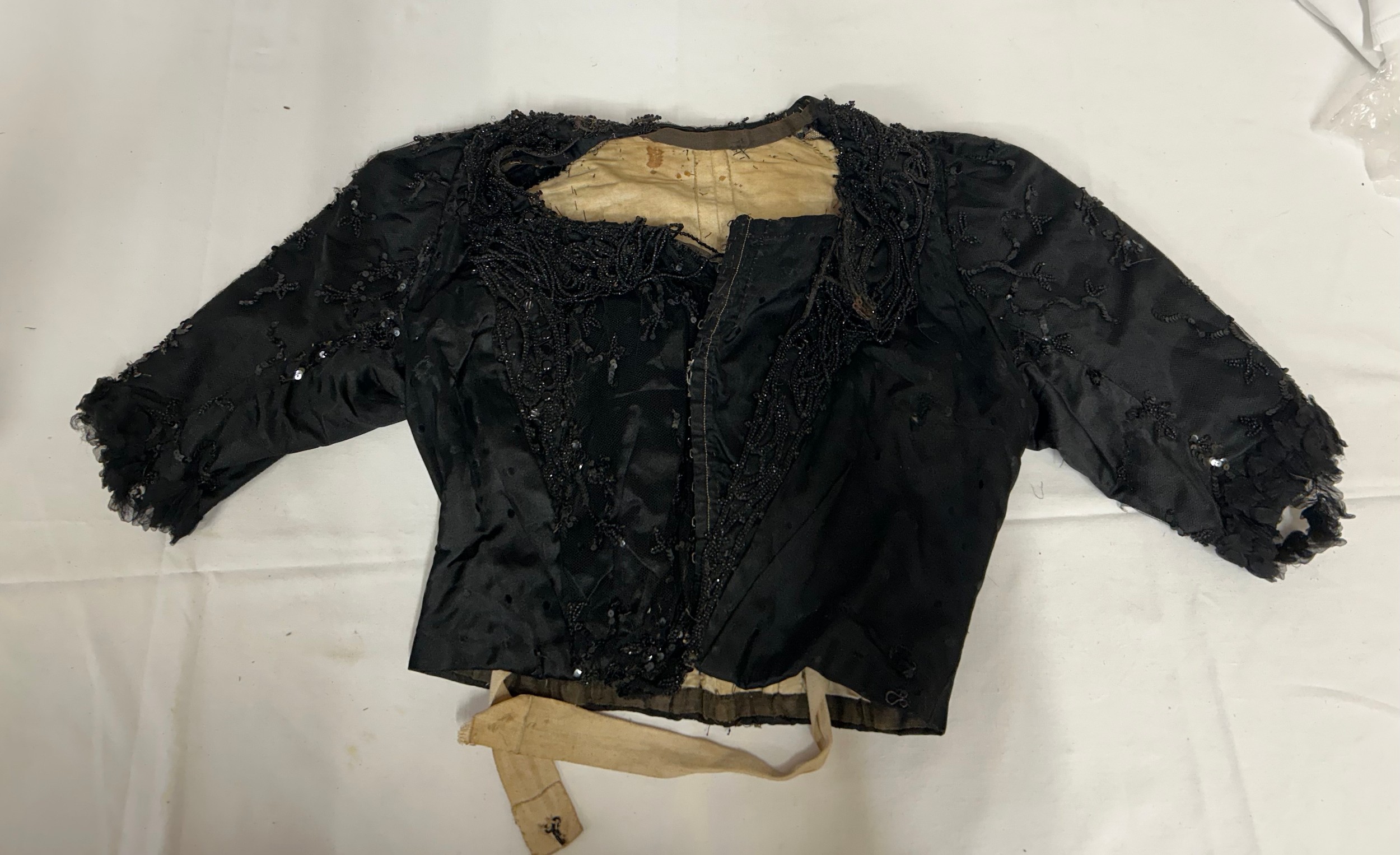 Two Victorian items of clothing to include a child’s dress in brown with black velvet trim, lace - Image 2 of 8