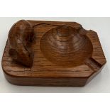 A Robert Thompson of Kilburn, Mouseman ashtray with carved signature mouse. 10cm x 7.5cm.