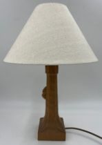 Robert 'Mouseman' Thompson. An English oak table lamp with an octagonal column on a square base with