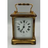 A brass cased carriage clock with French movement. Marked to face Barraclough & Sons Leeds. 10cm h.