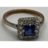 A 9 carat gold ring set with blue and clear stones. Size Q, weight 2.6gm.