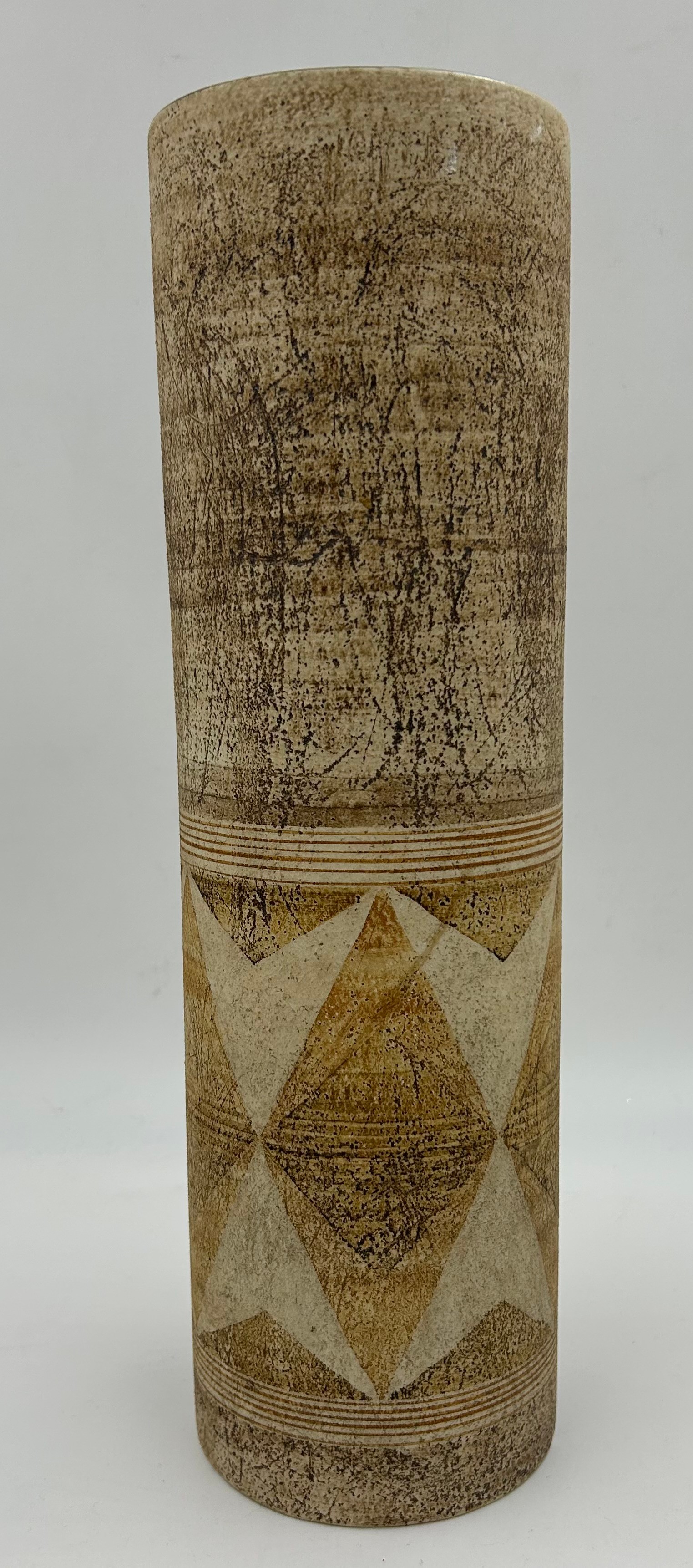 Large cylindrical Troika vase decorated in brown hues and geometric shapes to lower half, 37cm h x