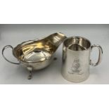 Silver sauce boat Sheffield 1933, maker Sydney Hall & Co together with a mug Sheffield 1915, maker