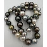 A Tahiti and south sea pearl necklace of natural colour. 42 pearls in total. 18 carat white gold