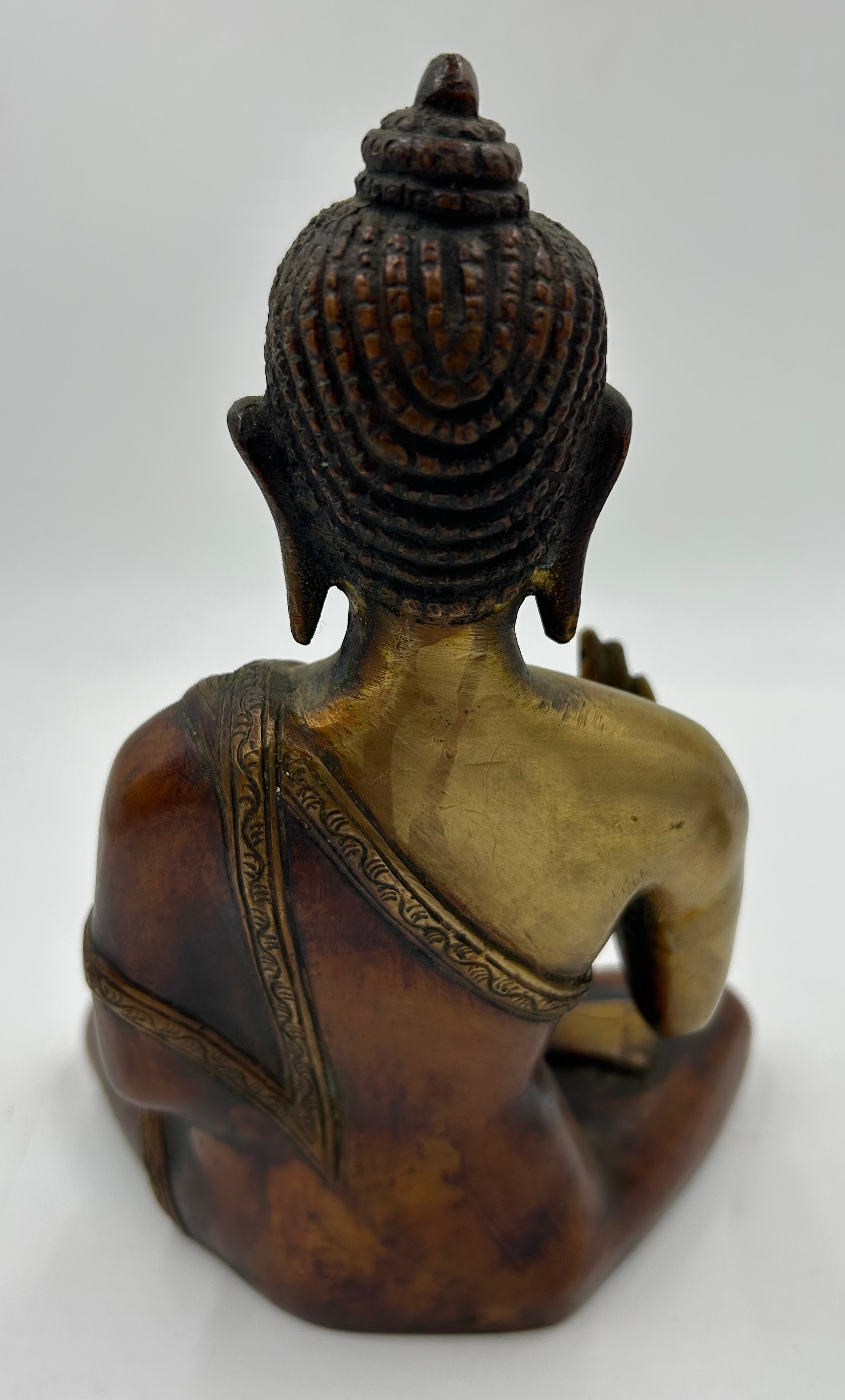 A Tibetan bronze seated figure of Green Tara 22cm h together with a heavy brass hand crafted meditat - Image 7 of 9