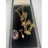 A 9 carat gold amethyst and seed pearl pendant on unmarked yellow metal chain together with an