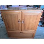 Ercol television cabinet with pull out shelf to base.