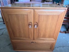 Ercol television cabinet with pull out shelf to base.