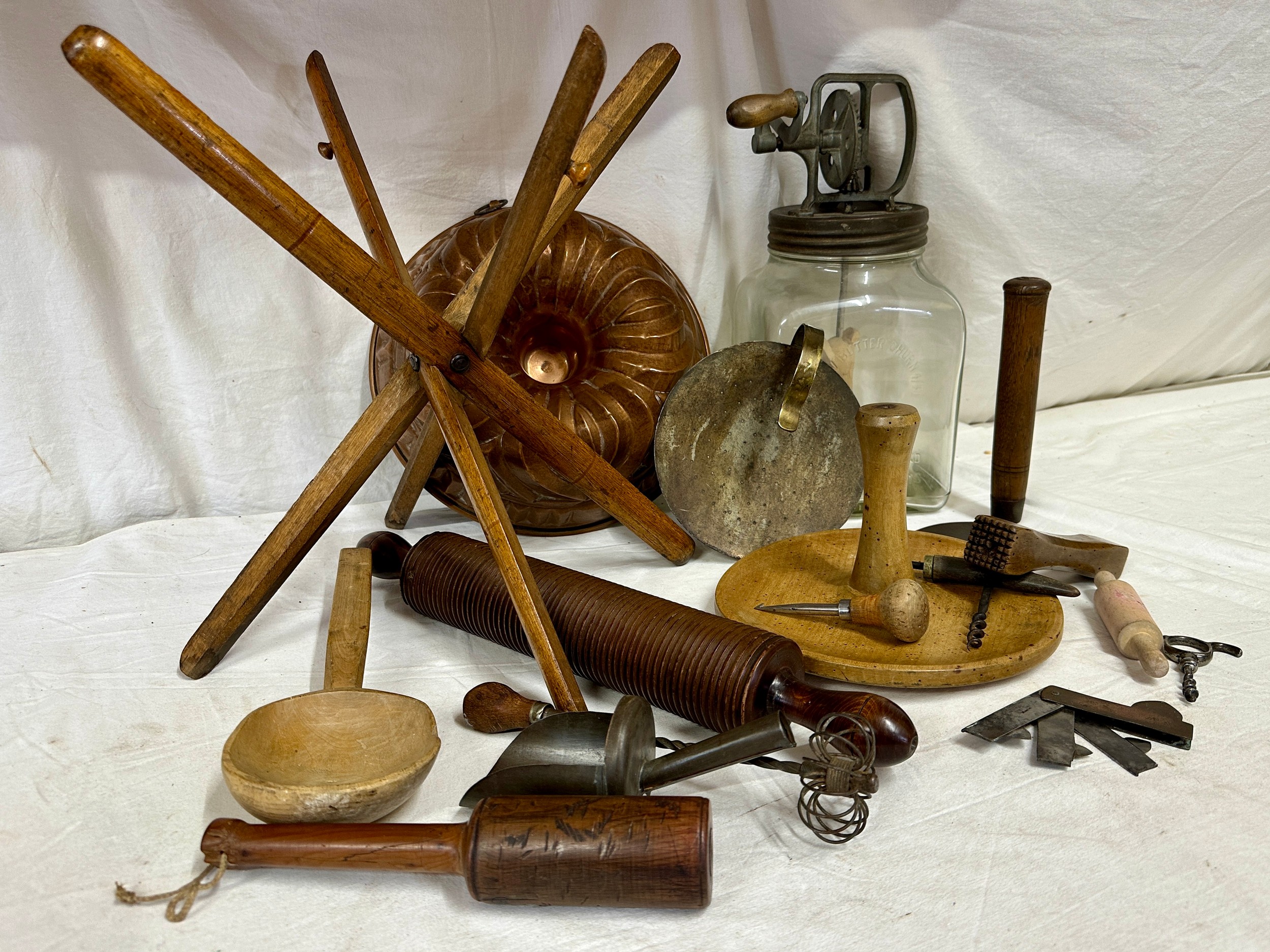 An assortment of kitchenalia to include a large copper mould 29cm d, a portable wooden stand, a Blow