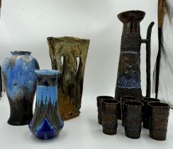 Selection of studio type ceramics to include a tall jug with six tumblers, one Chameleon Ware