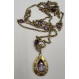 A 9 carat gold chain necklace set with amethysts and diamonds. Chain length 90cm approximately.