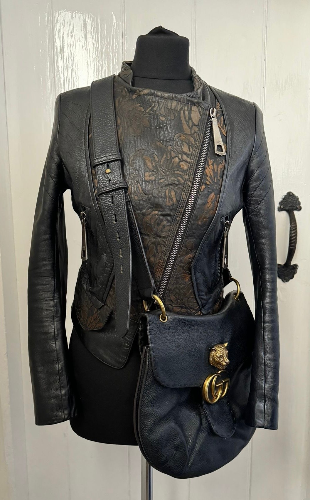 A real black leather jacket by Deja - Vu along with a genuine black leather Gucci Marmont bag.