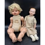 A Diamond Pottery Company bisque headed boy doll marked D.P.C 39-12 approx. 60cm together with a