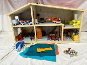 A Lundby Dolls House to include furniture by Marx, Tri-ang and various others some wooden. Approx