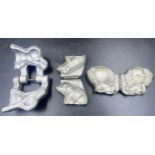 Three marzipan moulds of a a pig, an elephant and an Anton Reiche dog. Approx. 8 x 7cm.