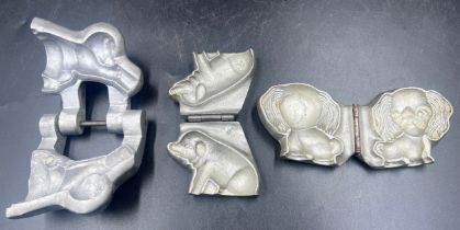 Three marzipan moulds of a a pig, an elephant and an Anton Reiche dog. Approx. 8 x 7cm.