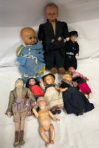 A collection of vintage dolls to include Kera doll in Dutch costume, a pot Dutch doll with clogs