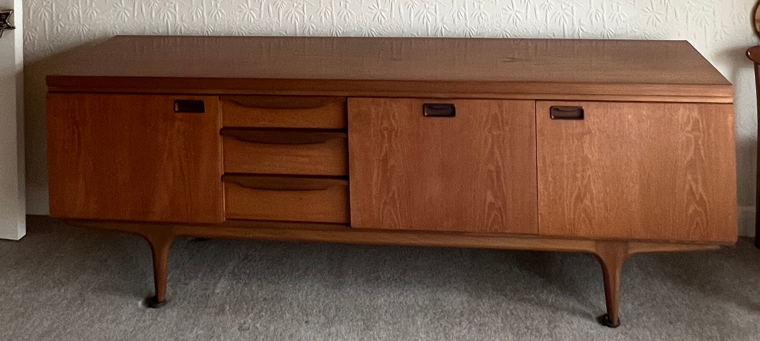 A mid 20thC teak sideboard with three cupboards and three drawers 220cm l x 45cm d x 77cm h. - Image 3 of 5