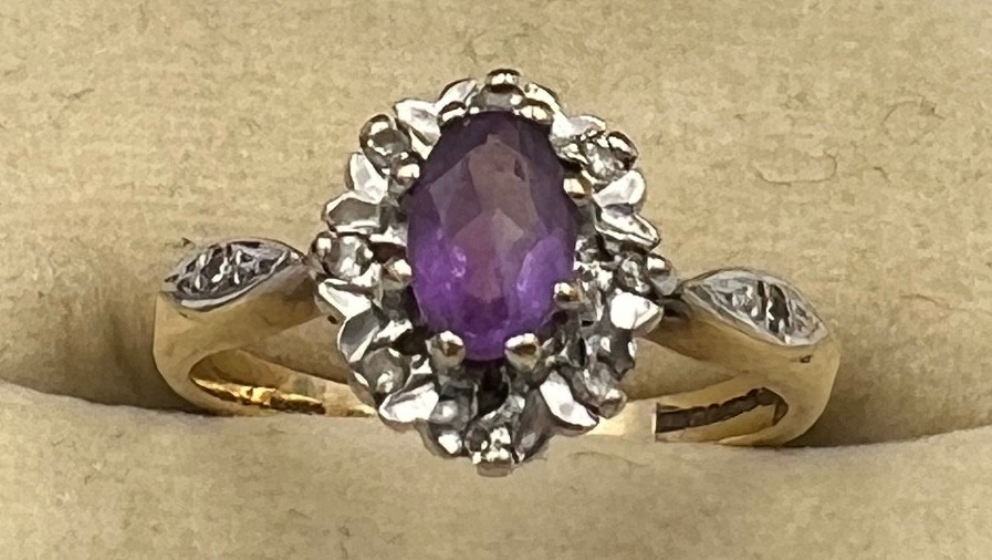 A 9 carat gold amethyst and diamond ring, size L, weight 2.4gm.