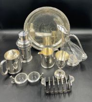 A box of good quality silver plated items to include claret jug, cocktail shaker, double salt, happy