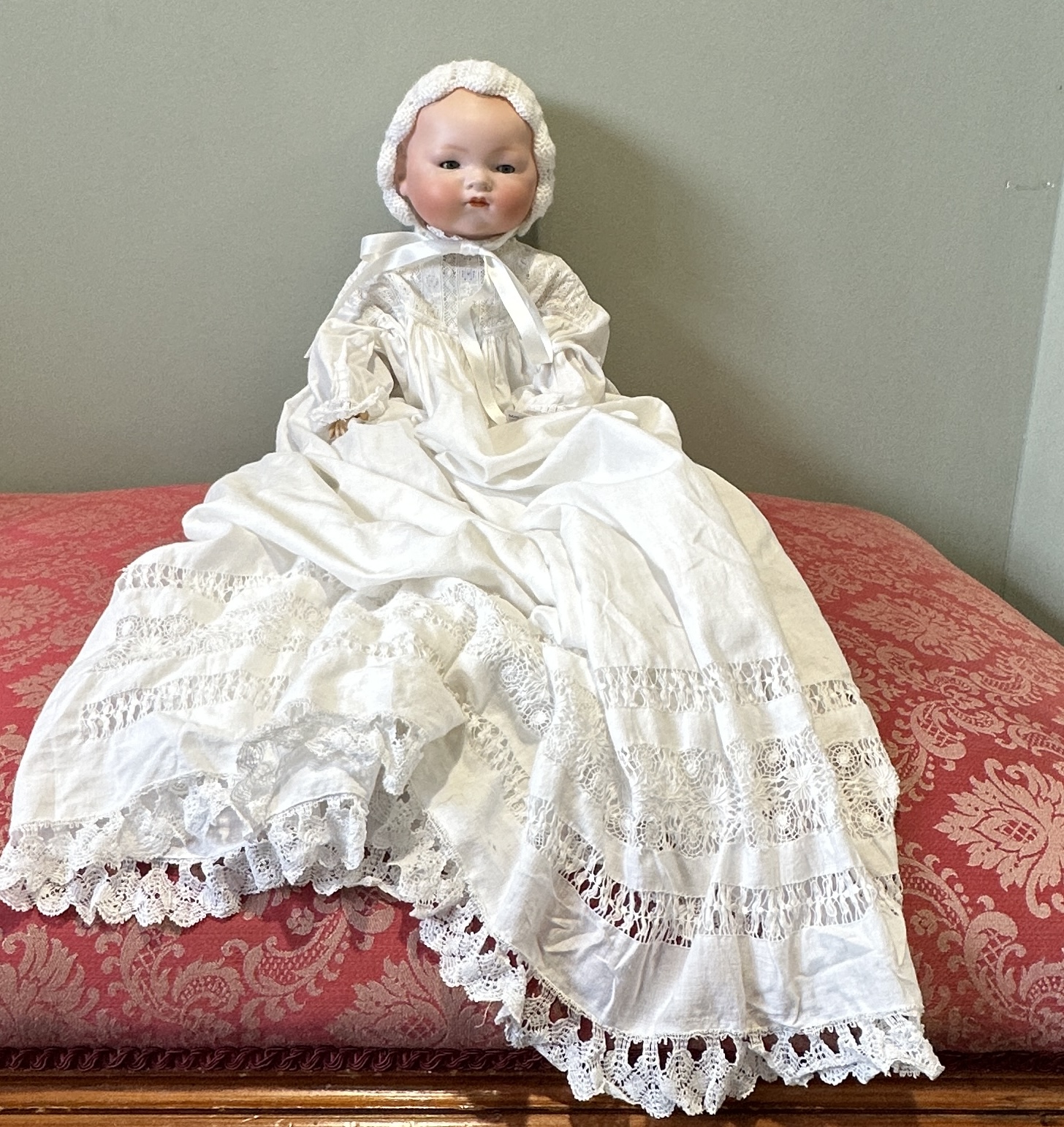 One Armand Marseille bisque headed doll in white cotton gowns. Marked A.M. Germany 341/8