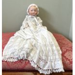 One Armand Marseille bisque headed doll in white cotton gowns. Marked A.M. Germany 341/8