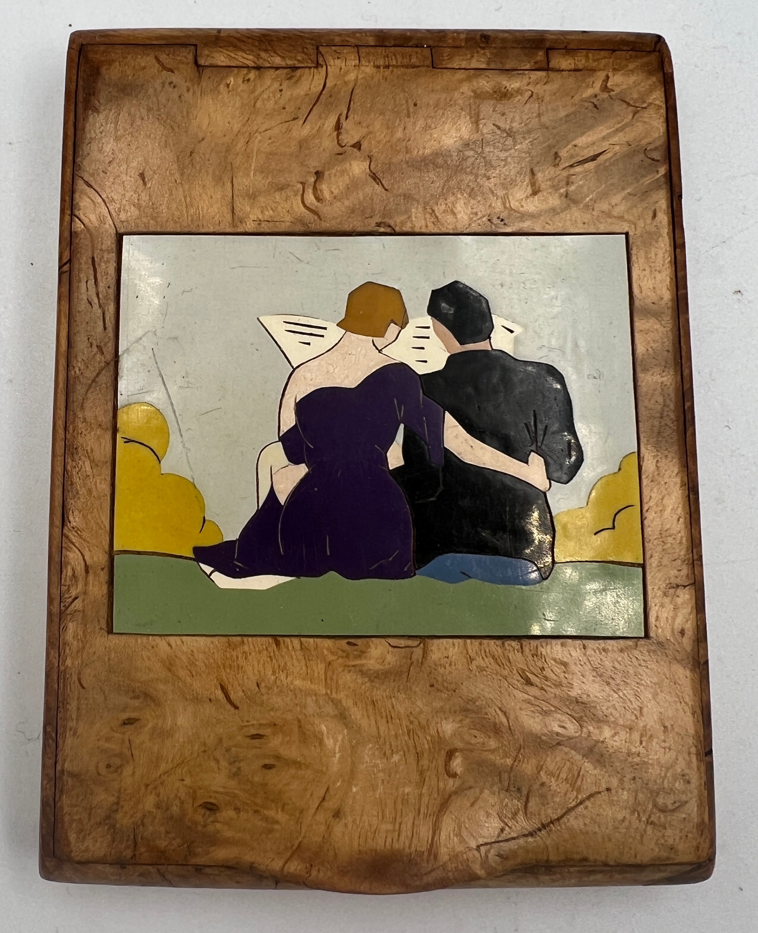 An early 20thC wooden inlaid card/cigarette case depicting courting couple with erotic image to