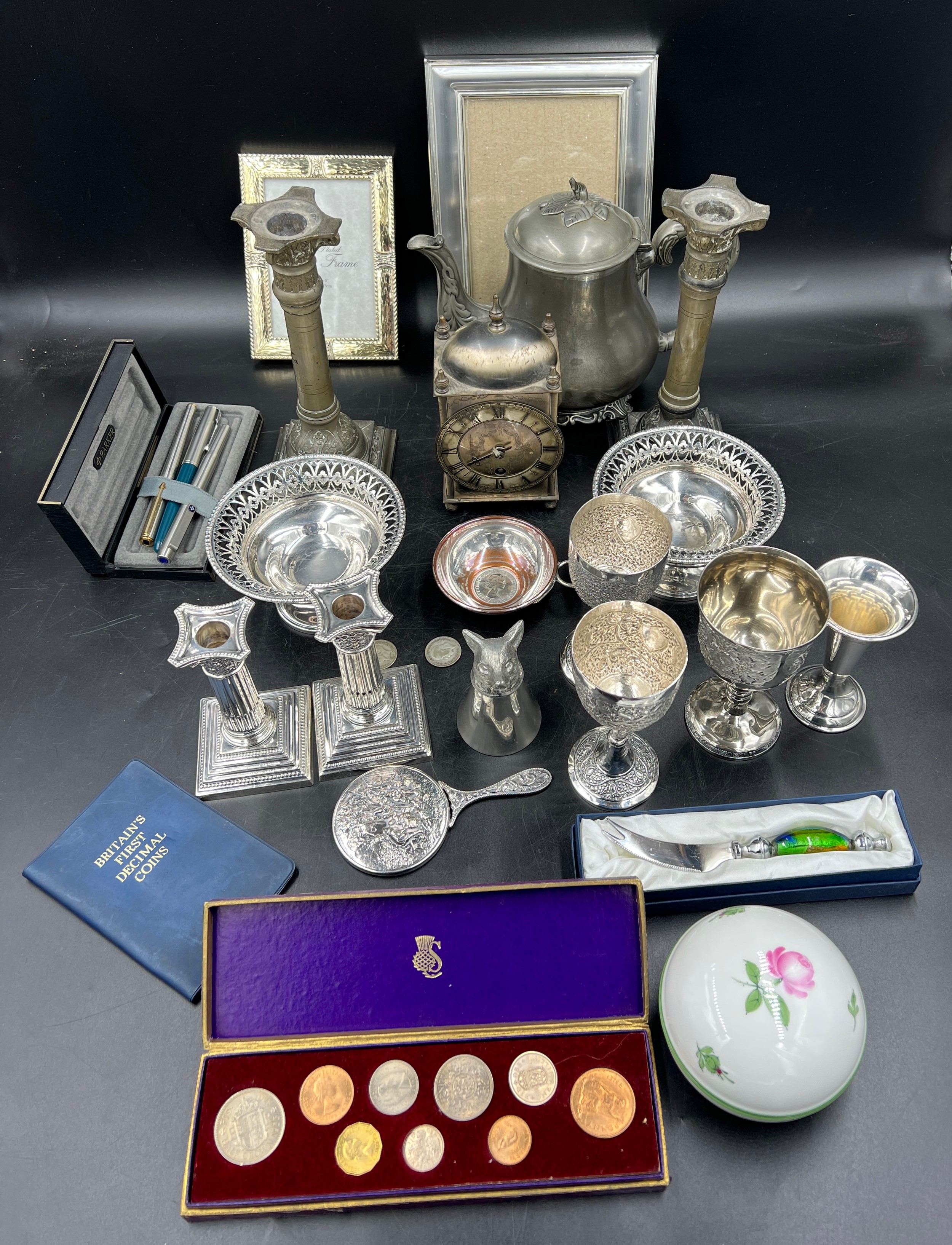 A miscellany to include Goldsmiths and silversmiths company Corinthian column candlesticks, beakers,