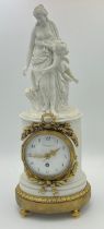 A French bisque porcelain mantel clock with female and cherub to top marked Falconnet with gilt