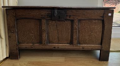 A 17thC oak coffer with iron lock and snipe hinges. 98cm w x 36cm d x 52cm h.