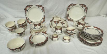 A Crown Ducal Orange Tree tea service to include: - Teapot stand and two teapots; five teacups;