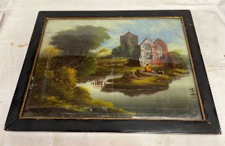 An oil on glass, rural scene with figure fishing beside a church and ruin. Image 36.5 x 51cm.