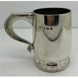 A silver mug Birmingham 1924, maker William Neale & Son Ltd. Weight 92gm. 8cm h.