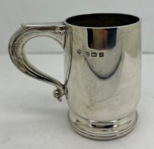 A silver mug Birmingham 1924, maker William Neale & Son Ltd. Weight 92gm. 8cm h.