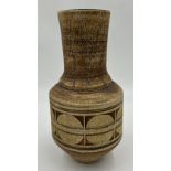 A Troika pottery circular tapered vase with geometric decoration on brown ground marked 'Troika