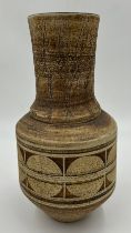 A Troika pottery circular tapered vase with geometric decoration on brown ground marked 'Troika