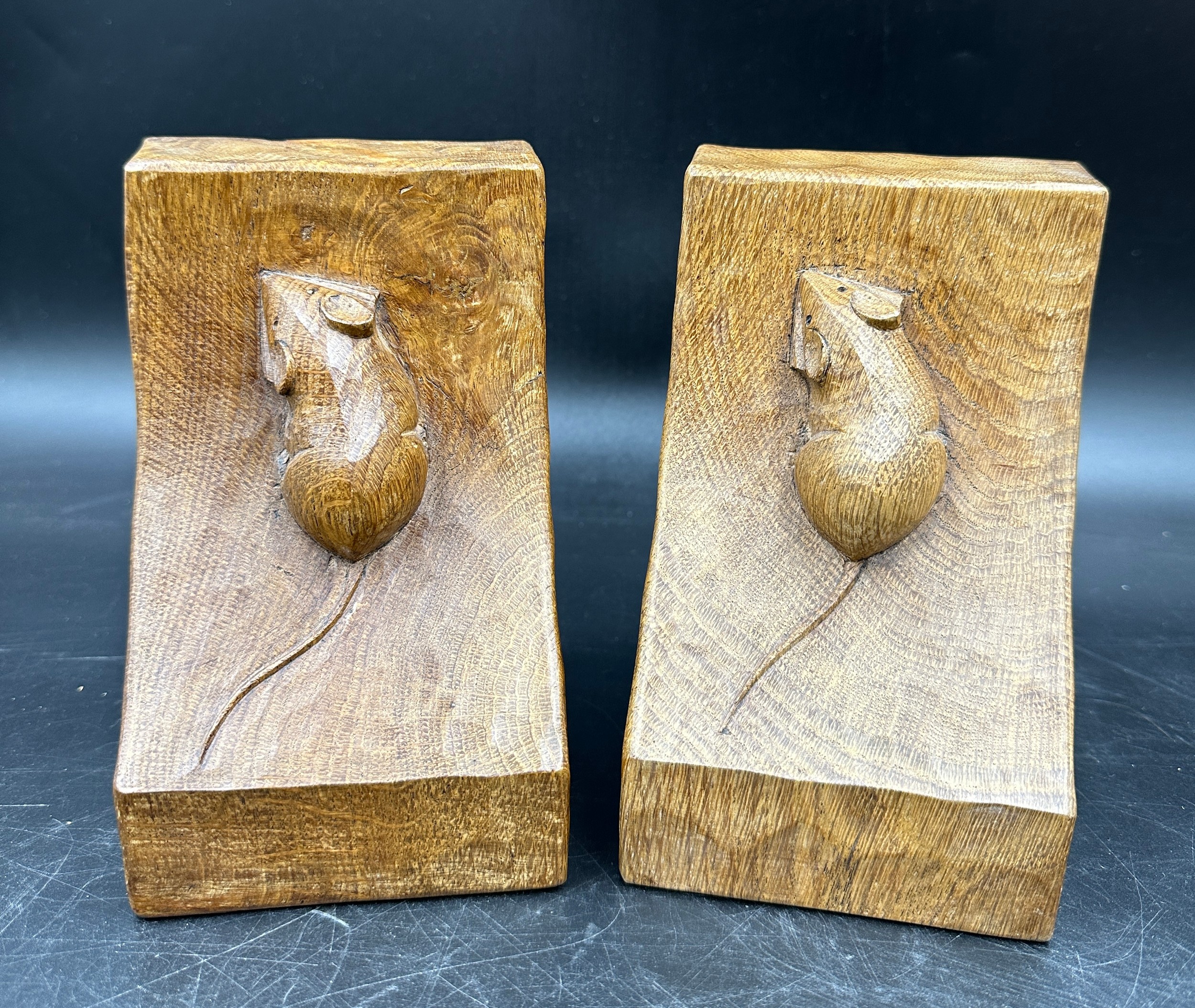 Robert 'Mouseman' Thompson - a pair of oak adzed book ends. 15cm h.