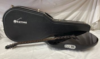 An Ovation Tangent T-257 electric guitar with an Ovation guitar case.