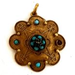 A 19thC 15 carat gold pendant set with turquoise and diamond chip. 2.5cm d. Weight 2.4gm.