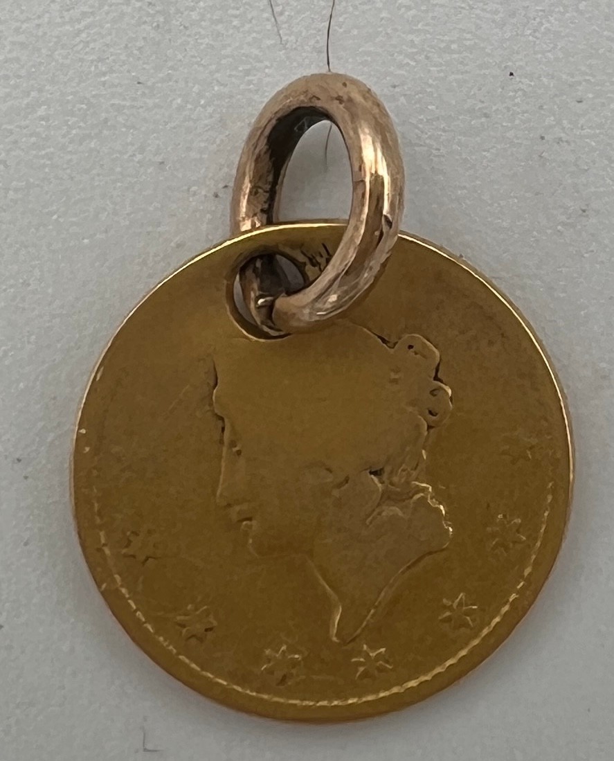 A gold American one dollar coin. 1852. Drilled with holes to make a pendant. - Bild 2 aus 2