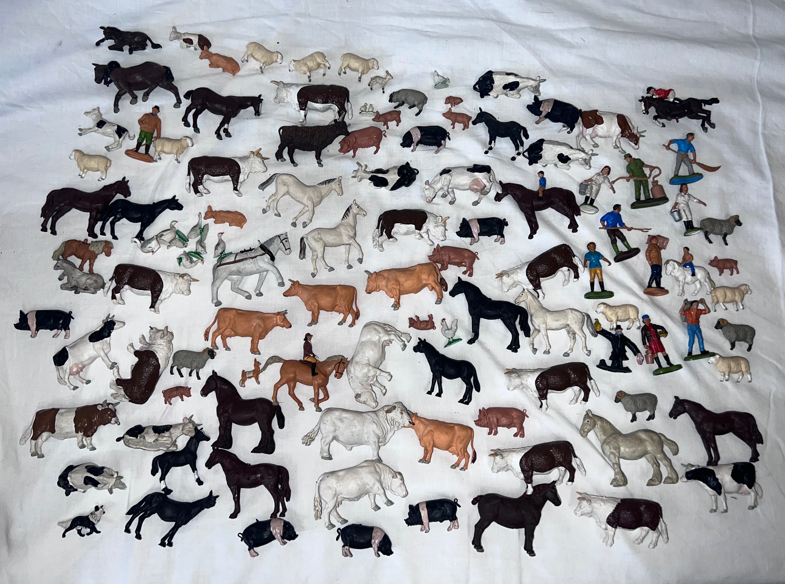 A large quantity of Britains farmyard & farmers animals to include Cows, Pigs, Sheep, Horses etc.